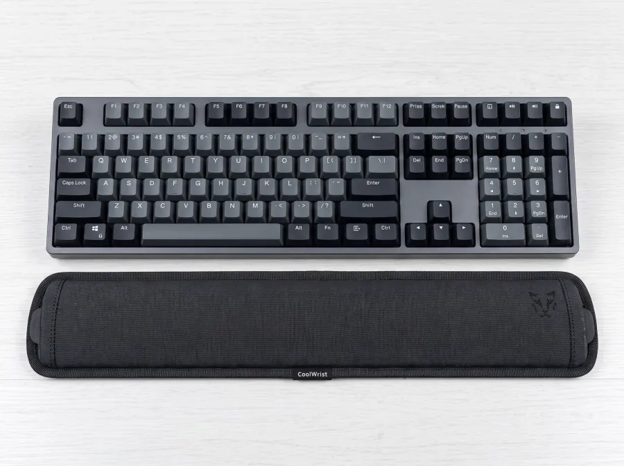 The CoolWrist sleeve along the bottom of a full-size keyboard.
